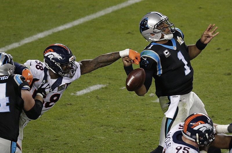 Denver Broncos' Von Miller (58) strips the ball from Carolina Panthers' Cam Newton (1) during the second half of the NFL Super Bowl 50 football game Sunday, Feb. 7, 2016, in Santa Clara, Calif.