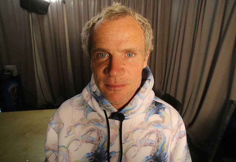 
              Red Hot Chili Peppers bassist Flea poses backstage for a photograph in San Francisco before the band takes the stage for the Direct TV Supersaturday concert series on Saturday, Feb. 6, 2016. Flea spoke about the band’s recent benefit for presidential candidate Bernie Sanders. (AP Photo/John Carucci)
            