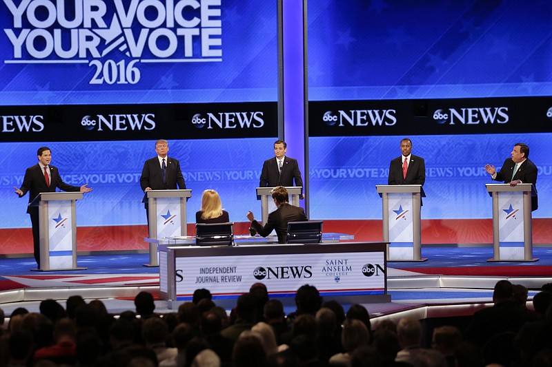 Republican presidential candidate, Sen. Marco Rubio, R-Fla., left, spars with Republican presidential candidate, New Jersey Gov. Chris Christie, right as Republican presidential candidate, businessman Donald Trump, Republican presidential candidate, Sen. Ted Cruz, R-Texas, and Republican presidential candidate, retired neurosurgeon Ben Carson listen during a Republican presidential primary debate hosted by ABC News at the St. Anselm College Saturday, Feb. 6, 2016, in Manchester, N.H.