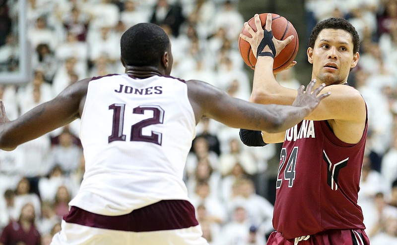 Senior forward Michael Carrera, right, helped South Carolina to an 81-78 upset victory at Texas A&M this past Saturday, when the Gamecocks became the first SEC team to win 20 games this season.