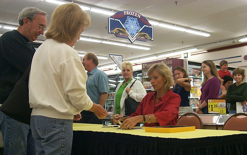 Tina Wesson, Season 2 winner of "Survivor," signs autographs at Bi-Lo on East Brainerd Road in 2003.