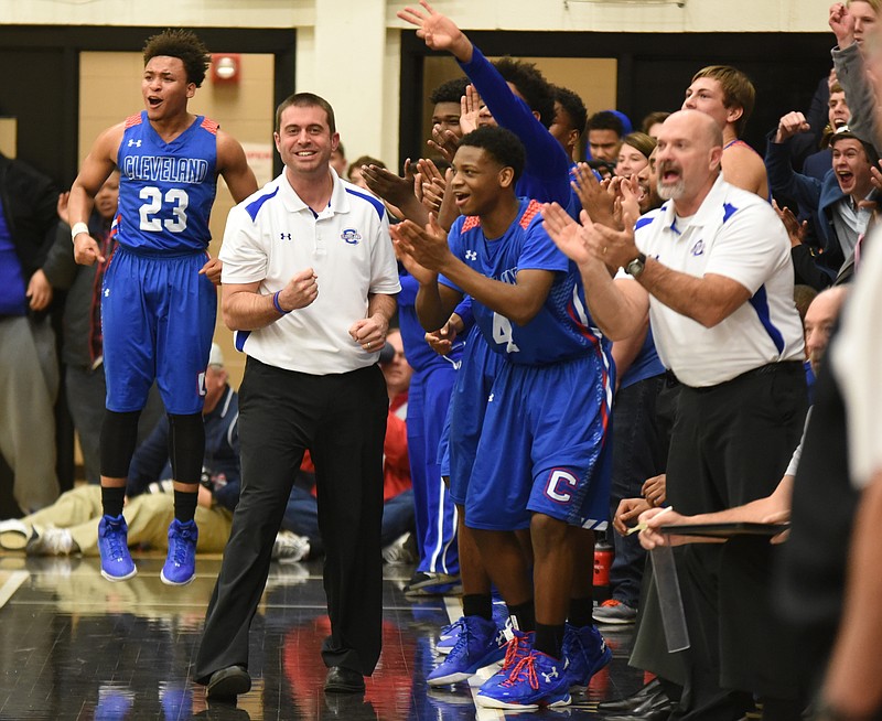 Cleveland coach Jason McCowan rejoices with his team at the end of the first half at Bradley Central on Monday night.