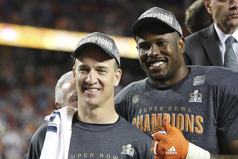 Denver Broncos’ Von Miller (58) and QB Peyton Manning (18) are seen post-game after a win against the Carolina Panthers after the NFL Super Bowl 50 football game Sunday, Feb. 7, 2016, in Santa Clara, Calif.  (AP Photo/Gregory Payan)