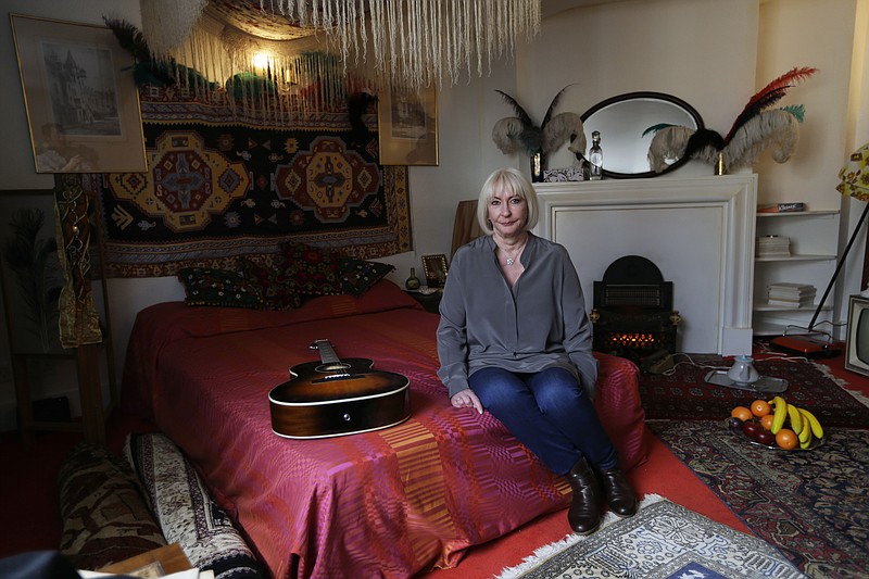 
              Kathy Etchingham, the former girlfriend of U.S. musician Jimi Hendrix, poses for photographers during a media preview in the bedroom of his former central London flat, at 23 Brook Street, London, Monday, Feb. 8, 2016. The flat where Hendrix lived in 1968 and 1969 opens to the public as a permanent exhibition on February 10 with the bedroom containing items sourced or crafted to replicate how it would have looked when he lived there. (AP Photo/Matt Dunham)
            