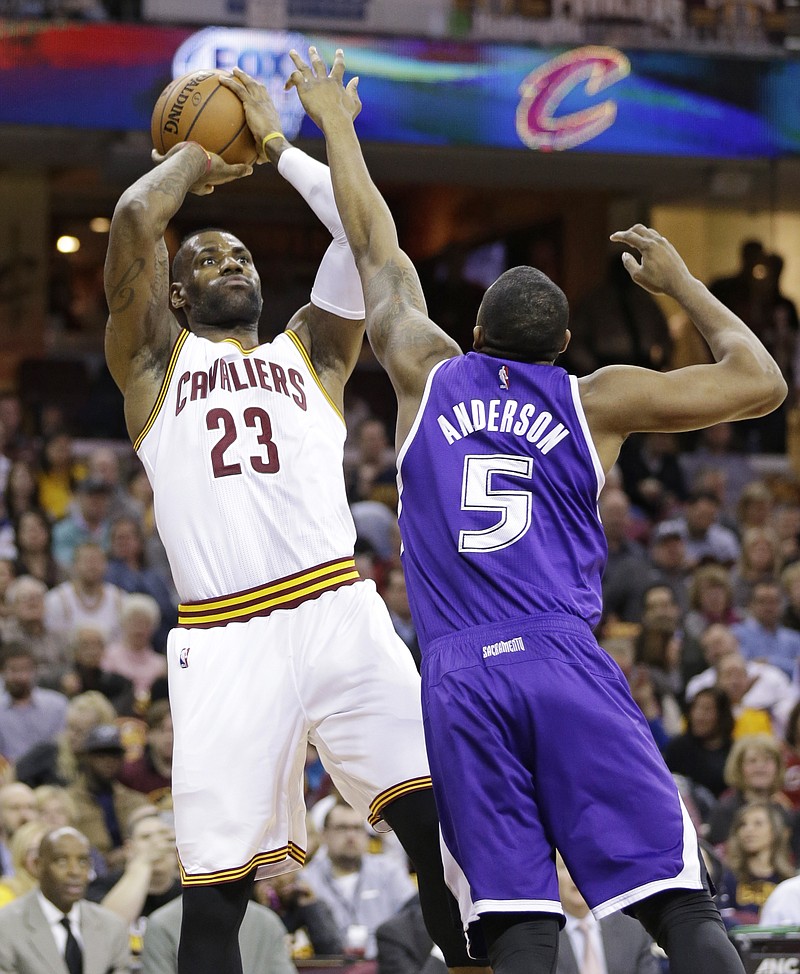 
              Cleveland Cavaliers' LeBron James (23) shoots over Sacramento Kings' James Anderson (5) in the first half of an NBA basketball game Monday, Feb. 8, 2016, in Cleveland. (AP Photo/Tony Dejak)
            