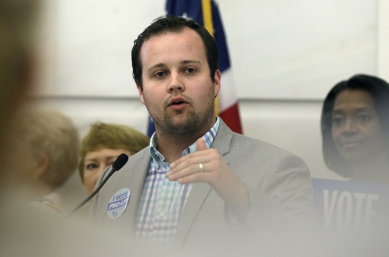 
              FILE - In this Aug. 29, 2014, file photo, Josh Duggar, executive director of FRC Action, speaks in favor the Pain-Capable Unborn Child Protection Act at the Arkansas state Capitol in Little Rock, Ark. A porn actress has dropped her $500,000 assault lawsuit against Duggar amid evidence that her claims were fabricated. (AP Photo/Danny Johnston, File)
            