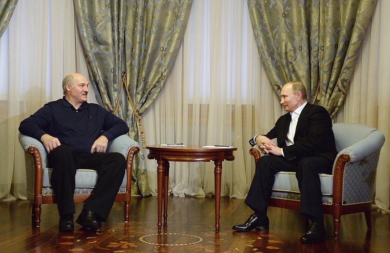 
              Russian President Vladimir Putin, right, meets with Belarusian President Alexander Lukashenko in the Bocharov Ruchei residence in the Black Sea resort of Sochi, Russia, Friday, Feb. 5, 2016. (Sputnik, Kremlin Pool Photo via AP)
            