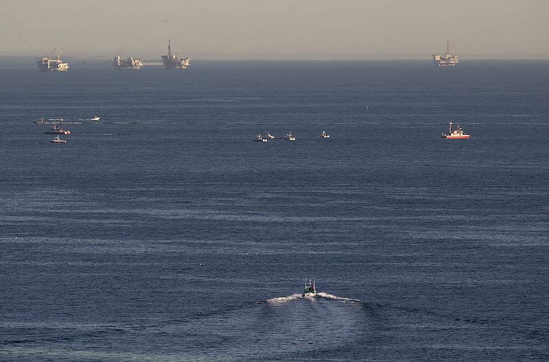 Rescue boats search for wreckage from two small planes that collided in midair and plunged into the ocean off of Los Angeles harbor Friday, Feb. 5, 2016, in San Pedro, Calif. 