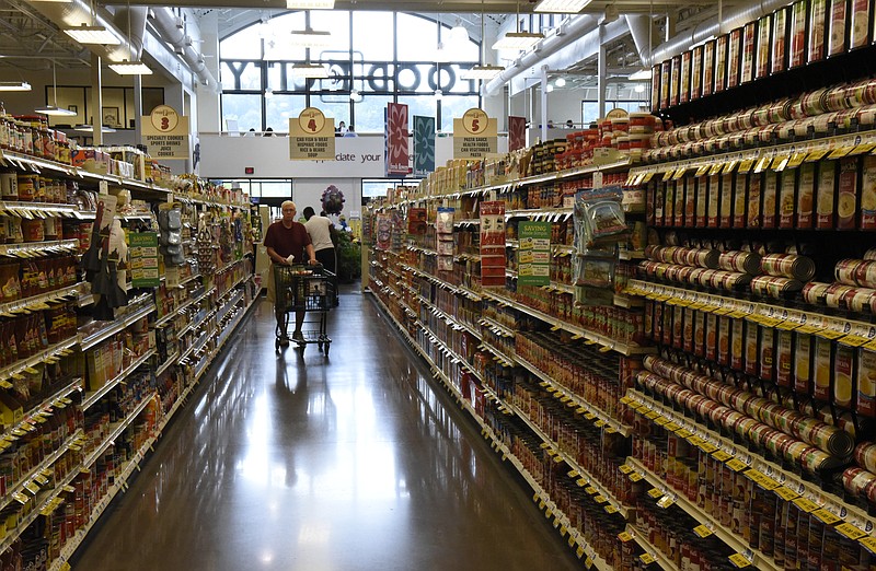 Shoppers push carts down an aisle on the first day of business for the Food City grocery store in Red Bank last September. Six months after entering the local market, Food City is preparing to renovate all its Chattanooga-area stores.