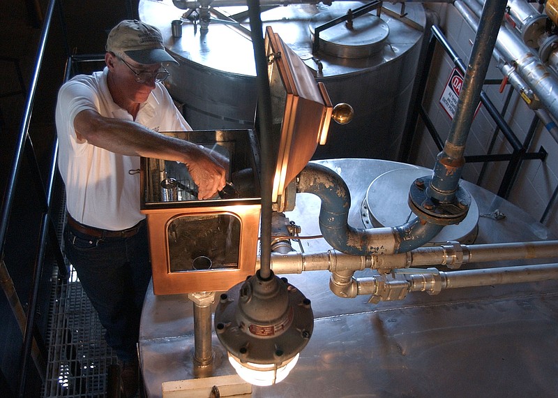 Gary Hinshaw tests the proof of the whiskey at the George Dickel Distillery near Tullahoma, Tenn., Tuesday, Sept. 16, 2003. The distillery is resuming production more than four years after the last barrel was filled. (AP Photo/Mark Humphrey)