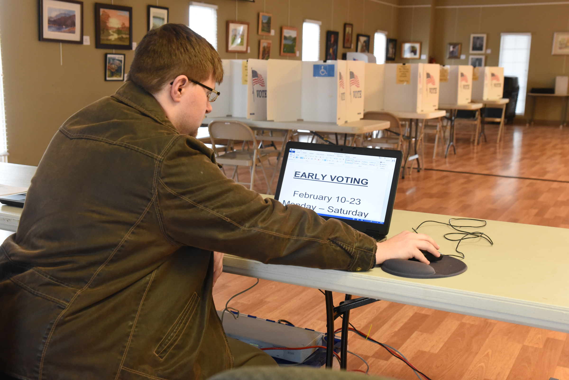 Late Tuesday afternoon, Elections Programer Nathan Foster makes sure computers and network are set up and ready for the first day of Early Voting at the North River Civic Center in Hixson.