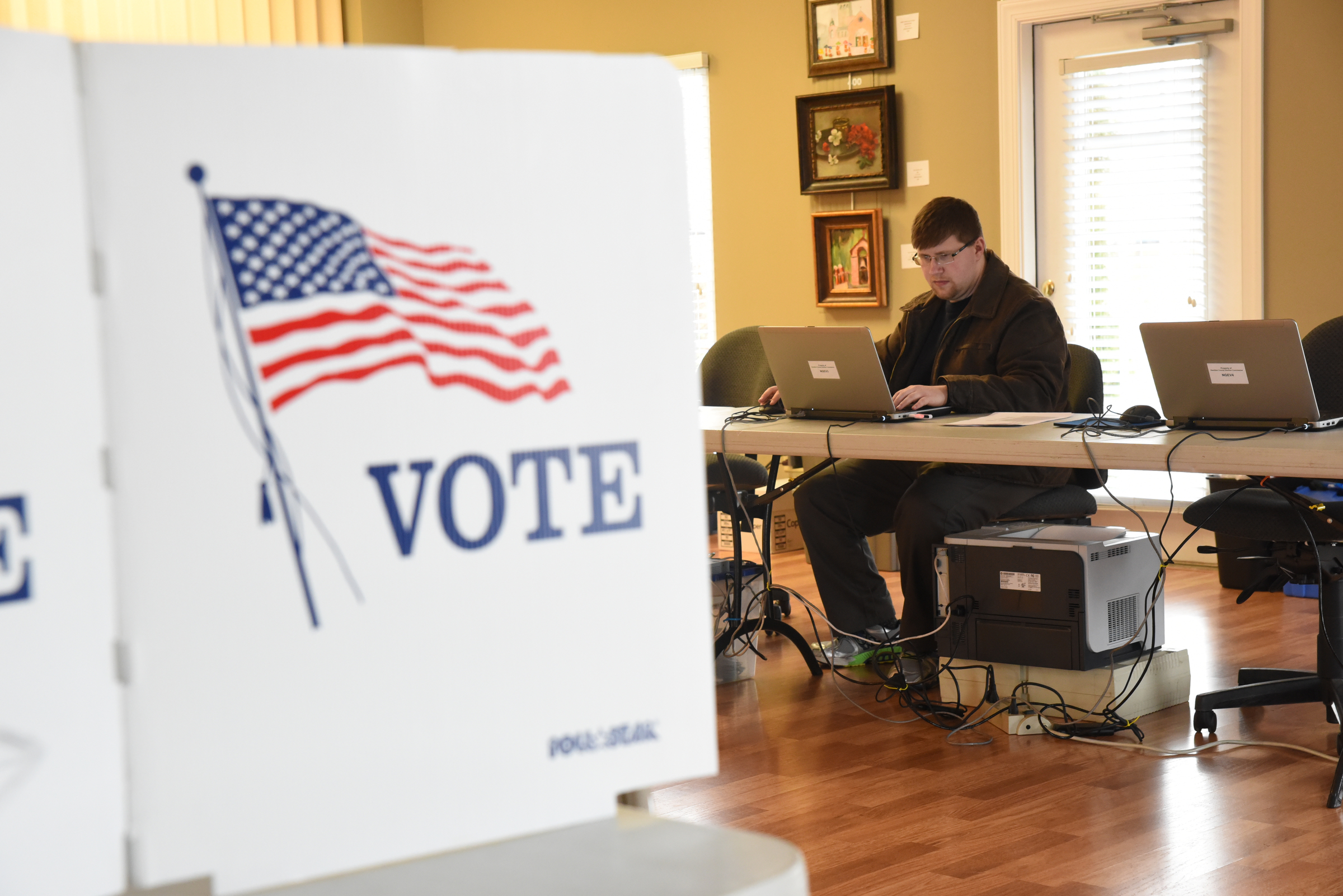 Late Tuesday afternoon, Elections Programer Nathan Foster makes sure computers and network are set up and ready for the first day of Early Voting at the North River Civic Center in Hixson.