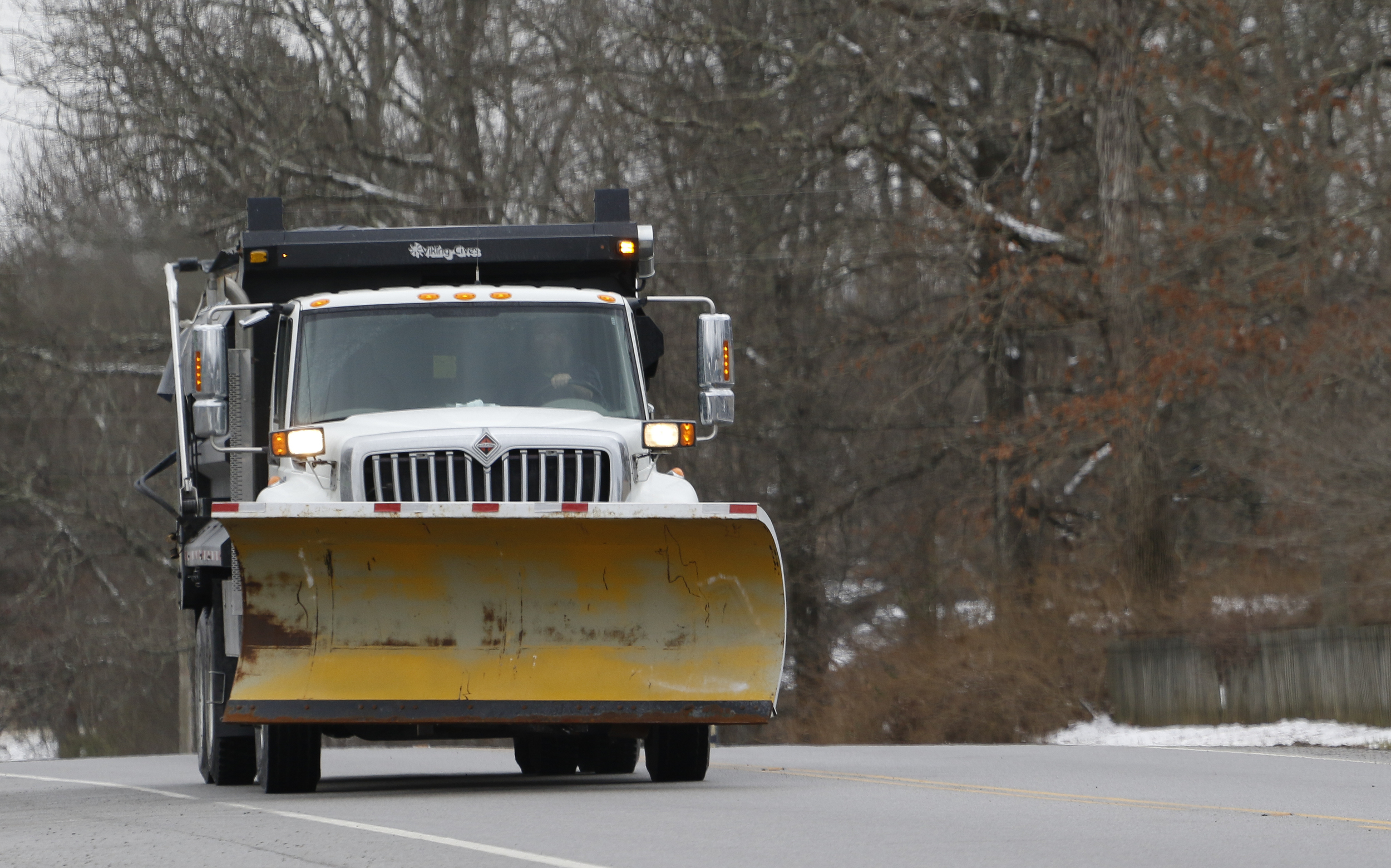 Staff Photo by Dan Henry / The Chattanooga Times Free Press- 2/9/16. A TDOT truck equipped for winter weather makes its way along Taft Highway atop Signal Mountain as snow falls in the Chattanooga area on Tuesday, February 9, 2015.