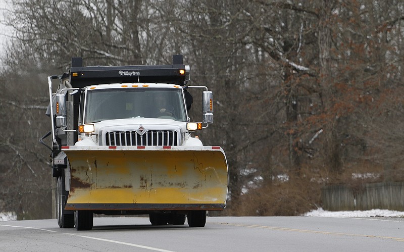 Staff Photo by Dan Henry / The Chattanooga Times Free Press- 2/9/16. A TDOT truck equipped for winter weather makes its way along Taft Highway atop Signal Mountain as snow falls in the Chattanooga area on Tuesday, February 9, 2015. 