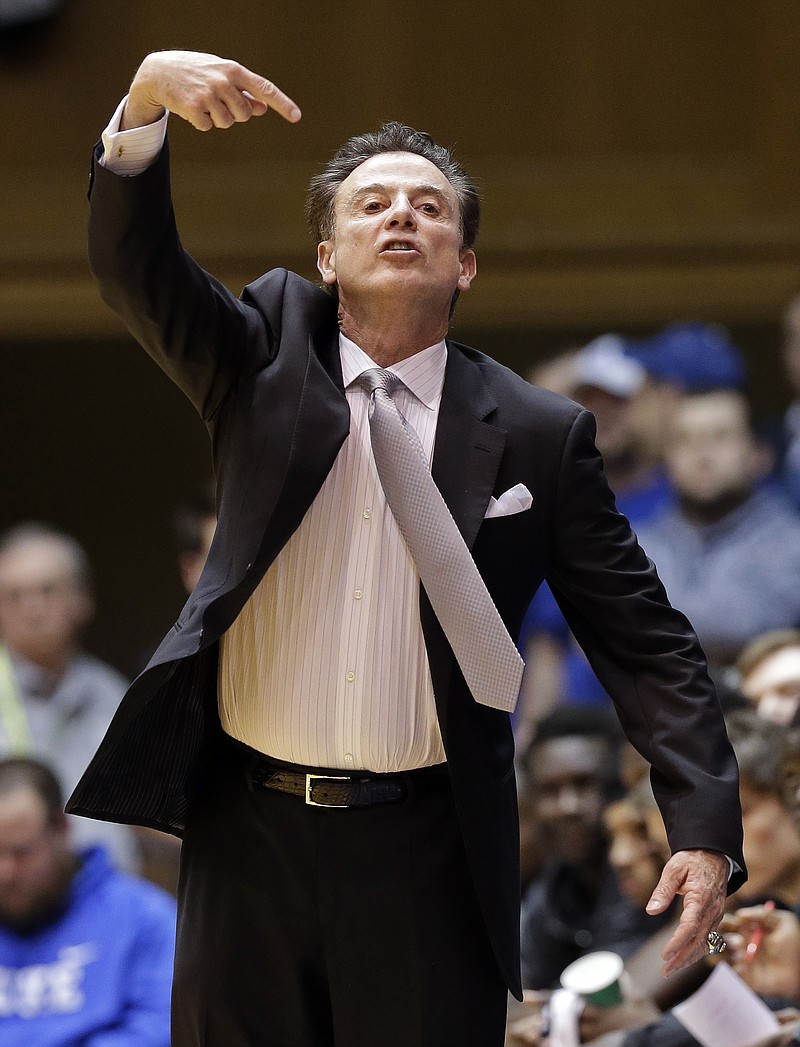 
              Louisville coach Rick Pitino directs his team during the first half of an NCAA college basketball game against Duke in Durham, N.C., Monday, Feb. 8, 2016. (AP Photo/Gerry Broome)
            