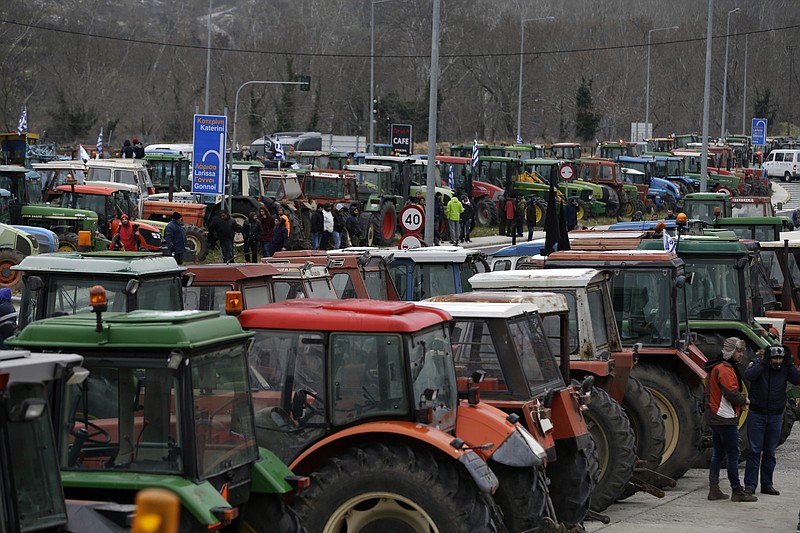 
              FILE - In this Wednesday, Jan. 20, 2016 file photo, protesting farmers from the agricultural region of Thessaly park their tractors in the Vale of Tempe, central Greece. Protest organizers said on Tuesday, Feb. 9, 2016 that the tractor blockade on the highway linking Athens to Greece’s second largest city, Thessaloniki, would be in effect indefinitely unless the government withdrew proposals for tax hikes and an overhaul of the pension system. (AP Photo/Thanassis Stavrakis, File)
            