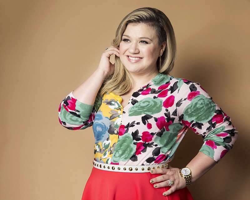 
              FILE - In this March 4, 2015 file photo, American singer and songwriter Kelly Clarkson poses for a portrait to promote her album "Piece by Piece" in New York. Clarkson has written a new song and a bedtime story for kids. "River Rose and the Magical Lullaby," will be released in October by HarperCollins Children's Books. (Photo by Victoria Will/Invision/AP, File)
            