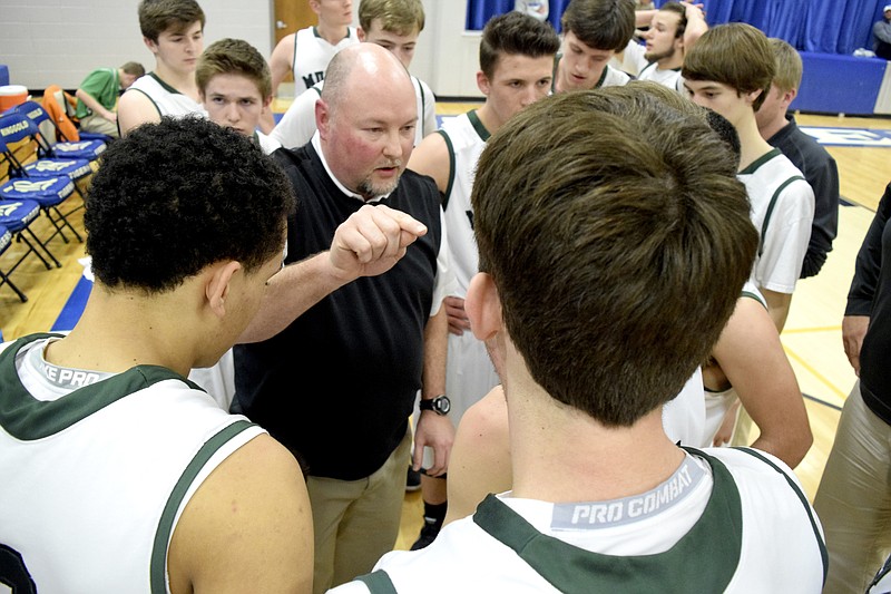 Murray County head coach Greg Linder directs the Indians between quarters. The Lakeview-Fort Oglethrope Warriors faced the Murray County Indians in GHSA District 6-AAA basketball tournament at Ringgold High School on Feb. 10, 2016.