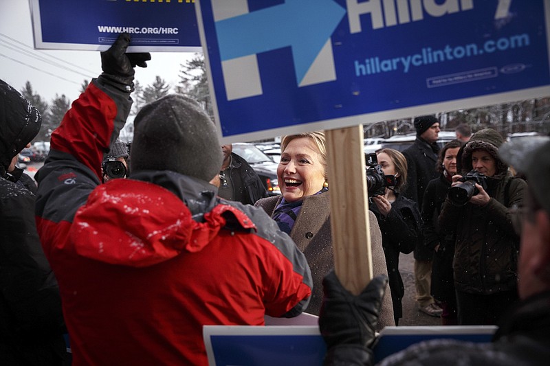 Democratic presidential hopeful Hillary Clinton greets supporters outside a polling station at Parker-Varney School in Manchesteron Tuesday.