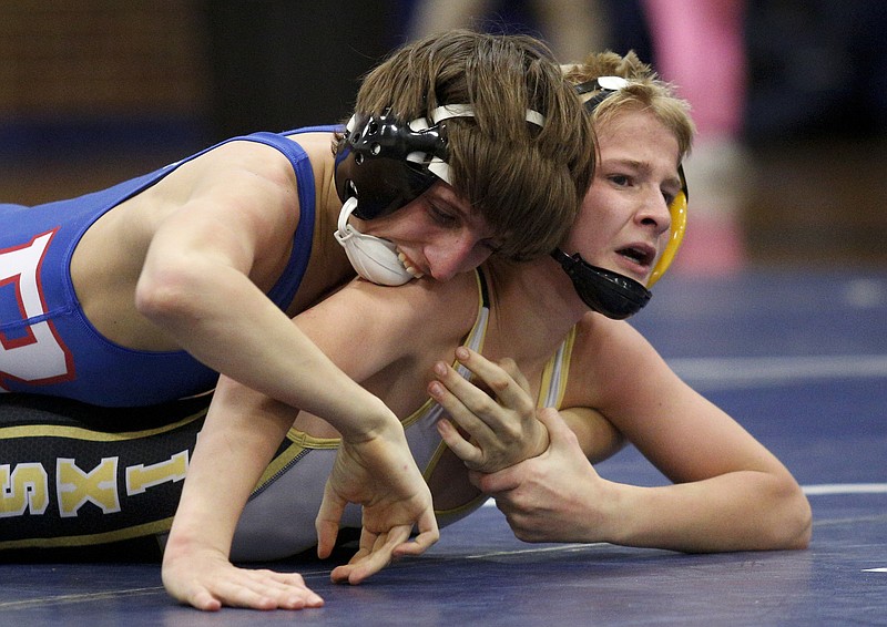 Red Bank's Zack Gee, left, works to turn Hixson's Rylie Hart in their 106-pound match last month. Both will compete in the Region 2-A/AA traditional tournament, which is Friday and Saturday at Hixson Middle School.