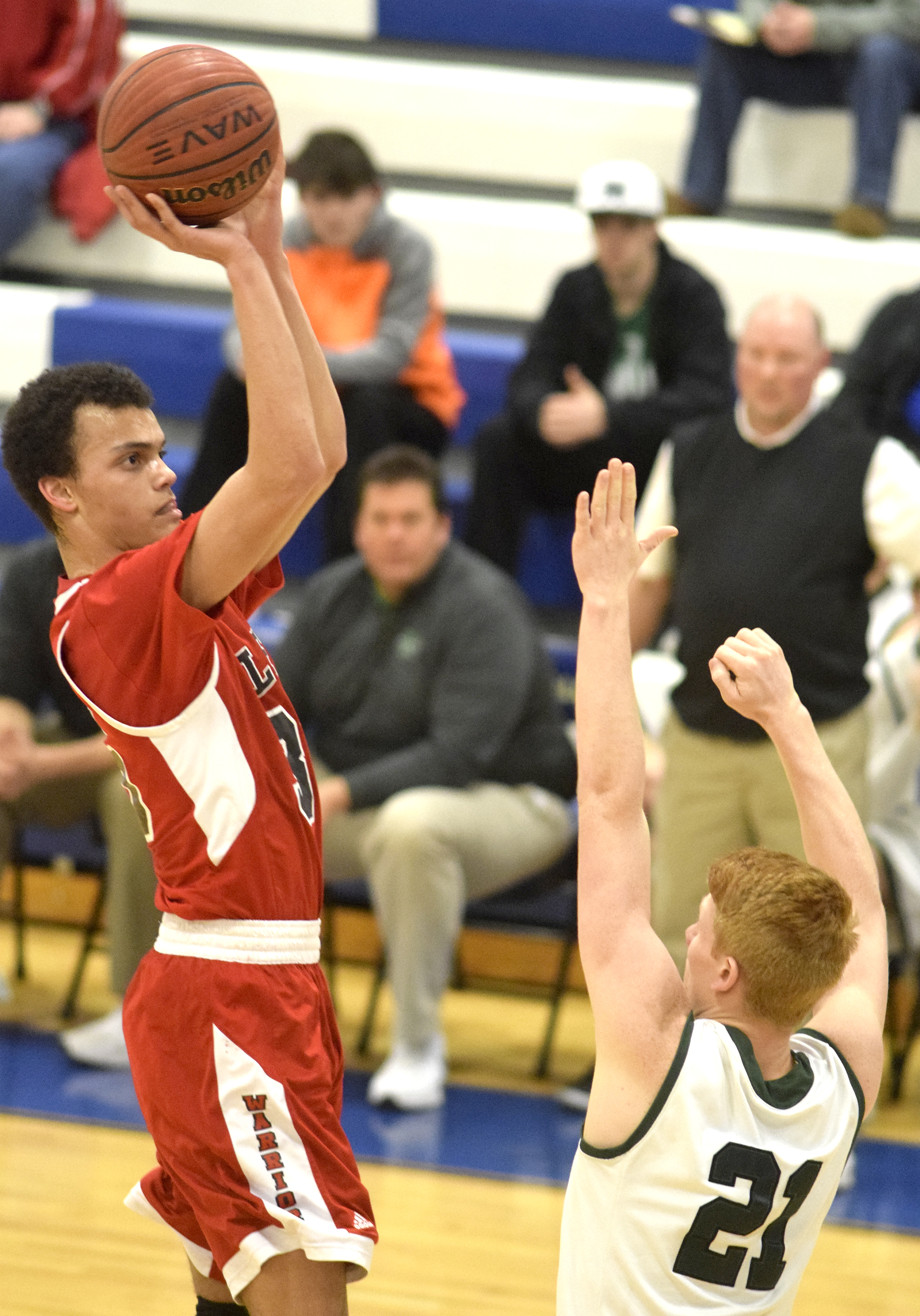 Lakeview's Zach Thompson (35) shoots a jumper over Murray County's Logan Bickford (21). The Lakeview-Fort Oglethrope Warriors faced the Murray County Indians in GHSA District 6-AAA basketball tournament at Ringgold High School, February 10, 2016.
