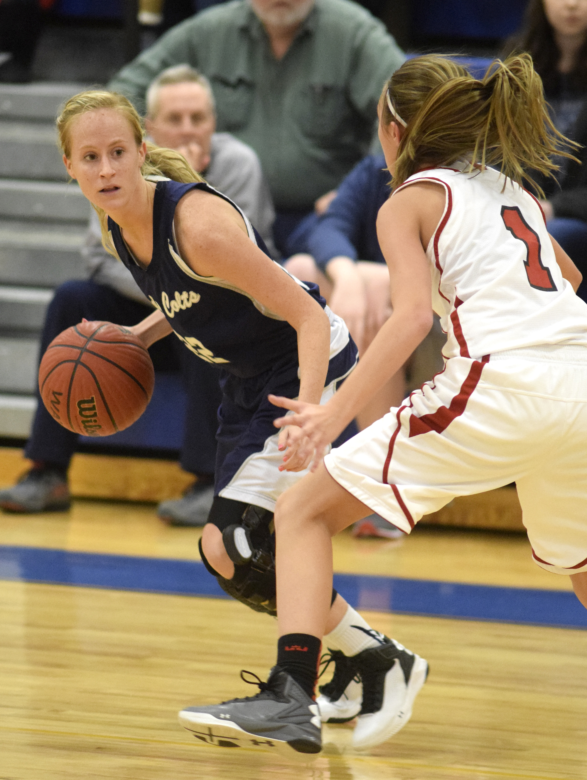 Coalhulla Creek's Beth Goodwin looks for an open teammate past Lakeview's Macy Gregg (1). The Lakeview-Fort Oglethrope Lady Warriors faced the Coalhulla Creek Lady Colts in GHSA District 6-AAA basketball tournament at Ringgold High School, February 10, 2016.