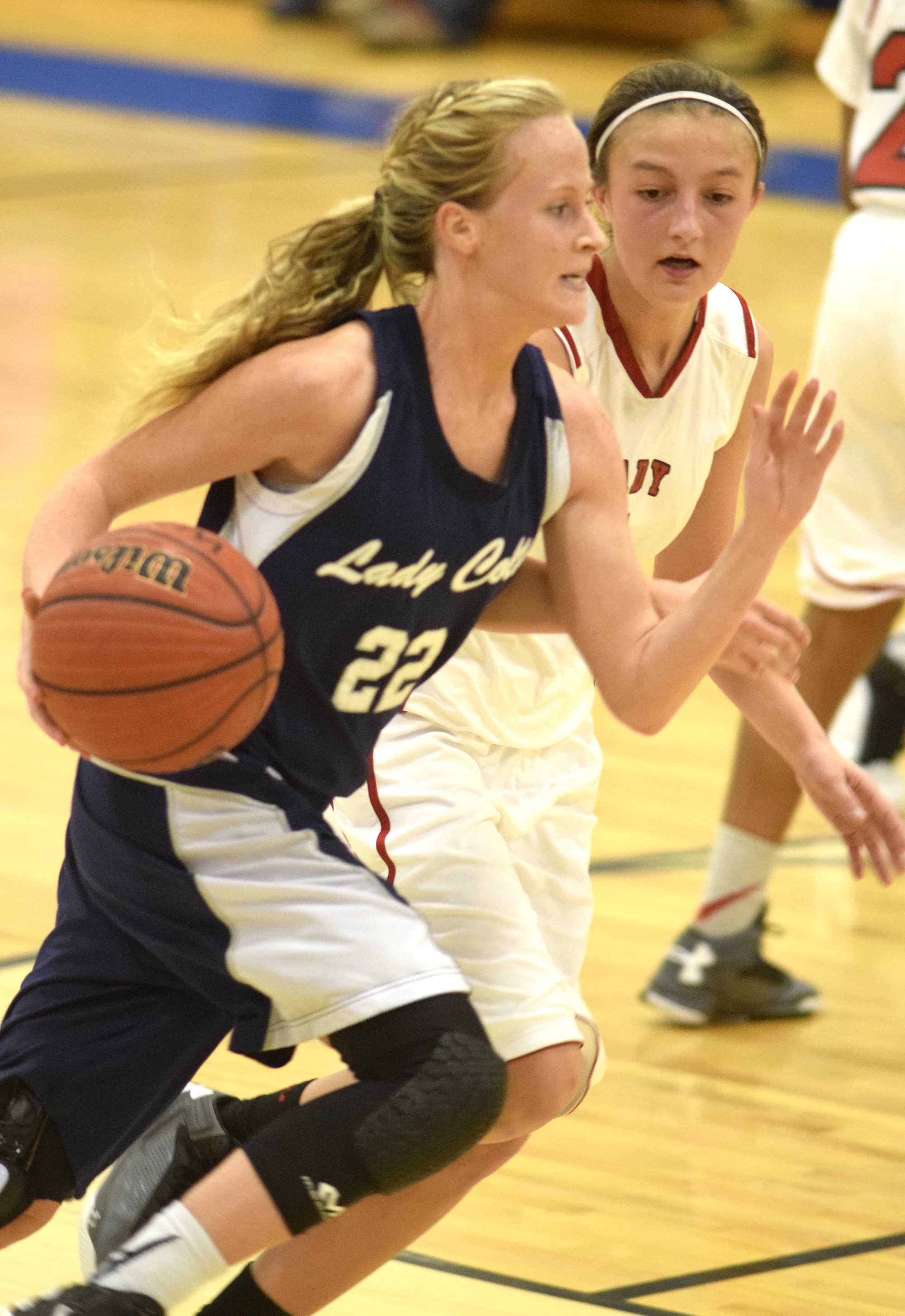 Coalhulla Creek's Beth Goodwin (22) dribbles past Lakeview's Macey Gregg (1). The Lakeview-Fort Oglethrope Lady Warriors faced the Coalhulla Creek Lady Colts in GHSA District 6-AAA basketball tournament at Ringgold High School, February 10, 2016.