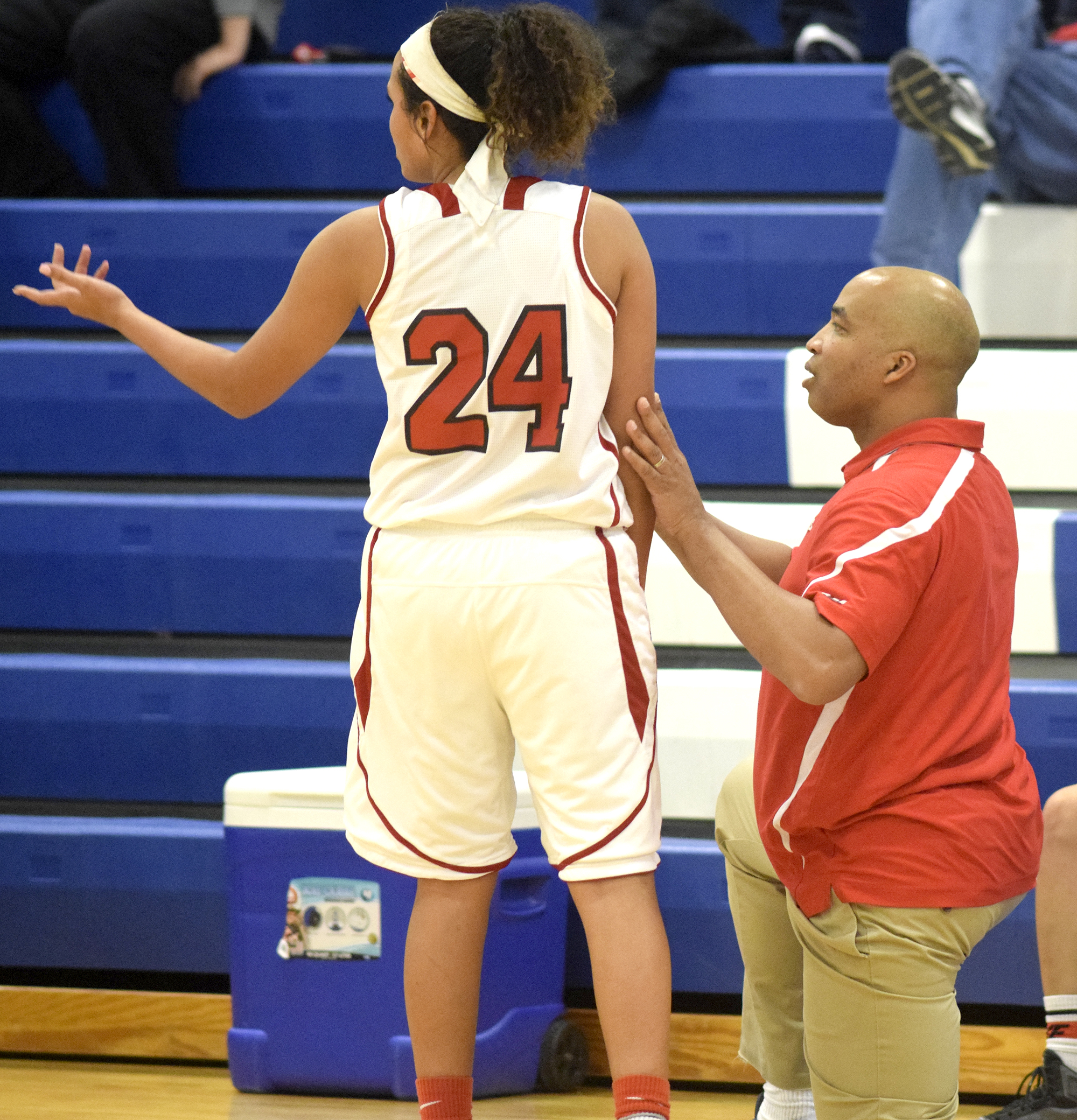 Lakeview head coach DeWayne Watkins talks to Zarria Nelson (24) after she fouled out of the game. The Lakeview-Fort Oglethrope Lady Warriors faced the Coalhulla Creek Lady Colts in GHSA District 6-AAA basketball tournament at Ringgold High School, February 10, 2016.