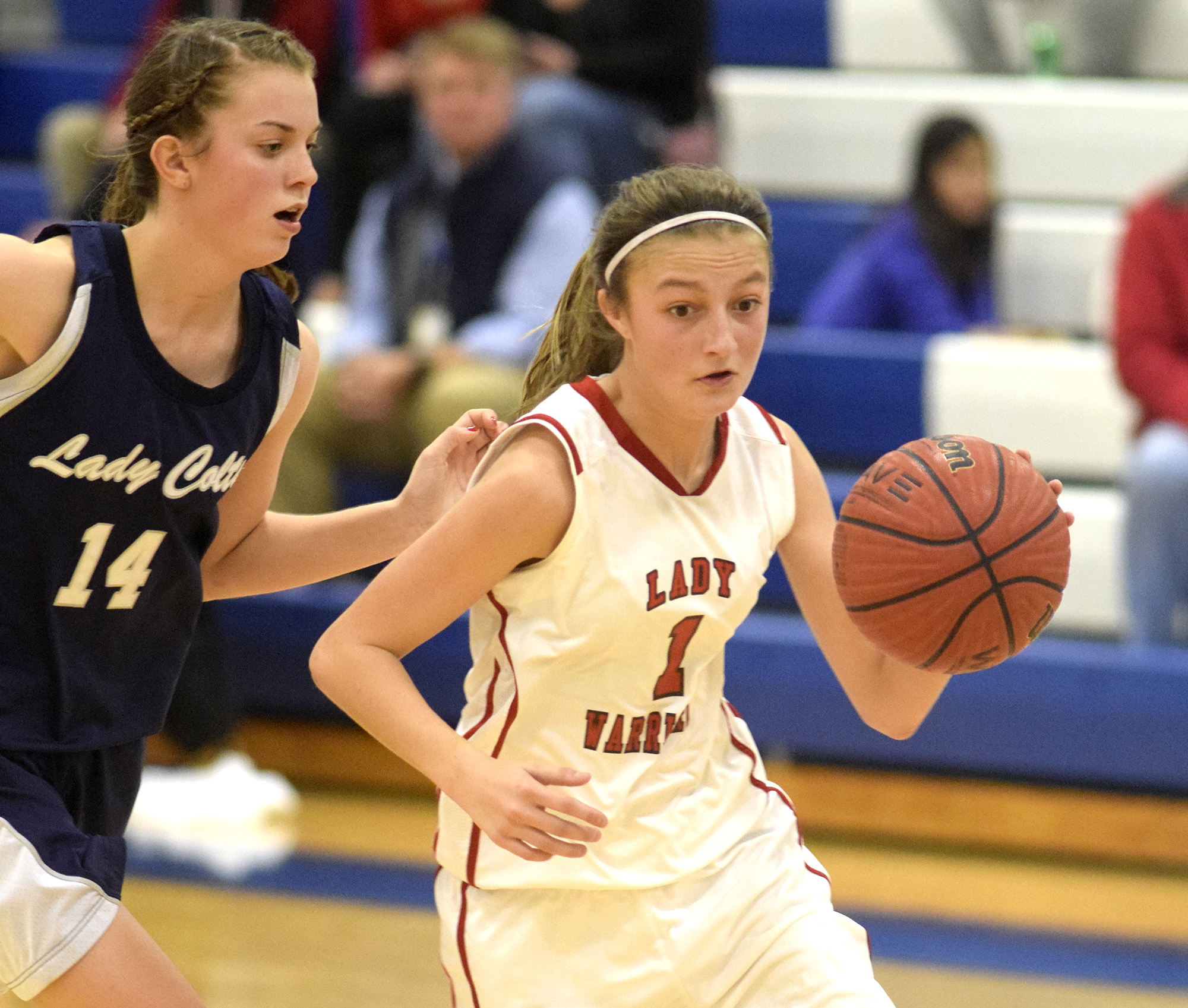 Lakeview's Macey Gregg (1) tries to kill the clock late in the game as she dribbles past Coalhulla Creek's Lily Sanders (14). The Lakeview-Fort Oglethrope Lady Warriors faced the Coalhulla Creek Lady Colts in GHSA District 6-AAA basketball tournament at Ringgold High School, February 10, 2016.