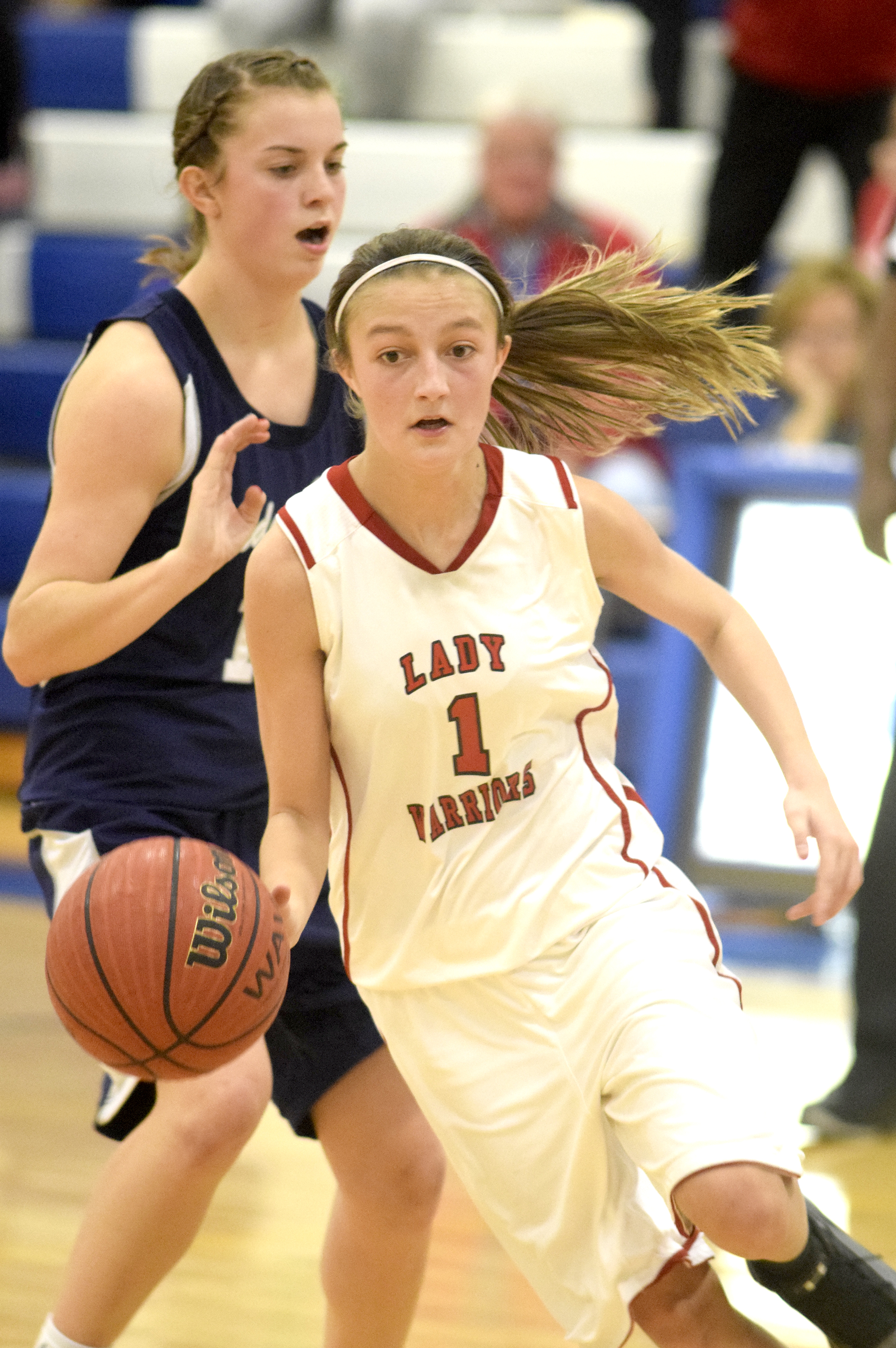 Lakeview's Macey Gregg (1) tries to kill the clock late in the game as she dribbles past Coalhulla Creek's Lily Sanders (14). The Lakeview-Fort Oglethrope Lady Warriors faced the Coalhulla Creek Lady Colts in GHSA District 6-AAA basketball tournament at Ringgold High School, February 10, 2016.