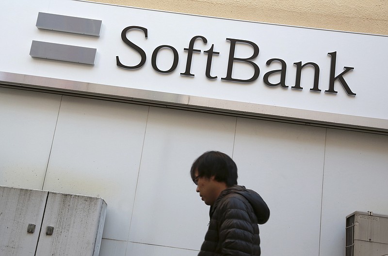 
              A man walks past a sign of SoftBank in Yokohama, near Tokyo, Wednesday, Feb. 10, 2016. Japanese telecommunications and Internet company SoftBank is reporting an 88 percent drop in fiscal third quarter profit as it struggles to turn around its U.S. carrier Sprint. (AP Photo/Eugene Hoshiko)
            