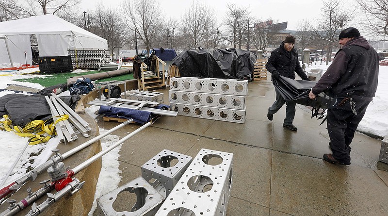 
              Crews dismantle sets in Manchester, N.H., on Wednesday, Feb. 10, 2016, the morning after the nation's first presidential primary. New Hampshire has only four electoral college votes, but its status as a swing state means whichever candidates end up as nominees likely will return. (AP Photo/Jim Cole)
            