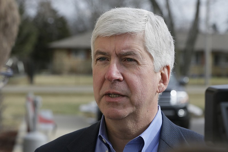 
              FILE-- In this Friday, Feb. 5, 2016 file photo, Michigan Gov. Rick Snyder is interviewed after visited a church that's distributing water and filters to its predominantly Latino parishioners in Flint, Mich. Snyder will propose spending $195 million more to address Flint’s water crisis and another $165 million updating infrastructure across the state in response to lead contamination overwhelming the city. The plan will be detailed in the Republican governor’s annual $54.9 billion budget presentation to the GOP-led Legislature on Wednesday, Feb. 10, 2016. (AP Photo/Carlos Osorio, File)
            