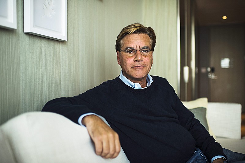 
              FILE - In this Oct. 20, 2015 file photo, screenwriter Aaron Sorkin poses for a photo while promoting his movie "Steve Jobs," in Toronto. Harper Lee’s classic novel “To Kill a Mockingbird” - and it’s classic hero Atticus Finch - are heading to Broadway in a new adaptation written by Sorkin. Producer Scott Rudin said the play will make it for the 2017-2018 season, under the direction of Tony Award winner Bartlett Sher, who is represented on Broadway now with “The King and I” and “Fiddler on the Roof.” (Aaron Vincent Elkaim/The Canadian Press via AP, File)
            