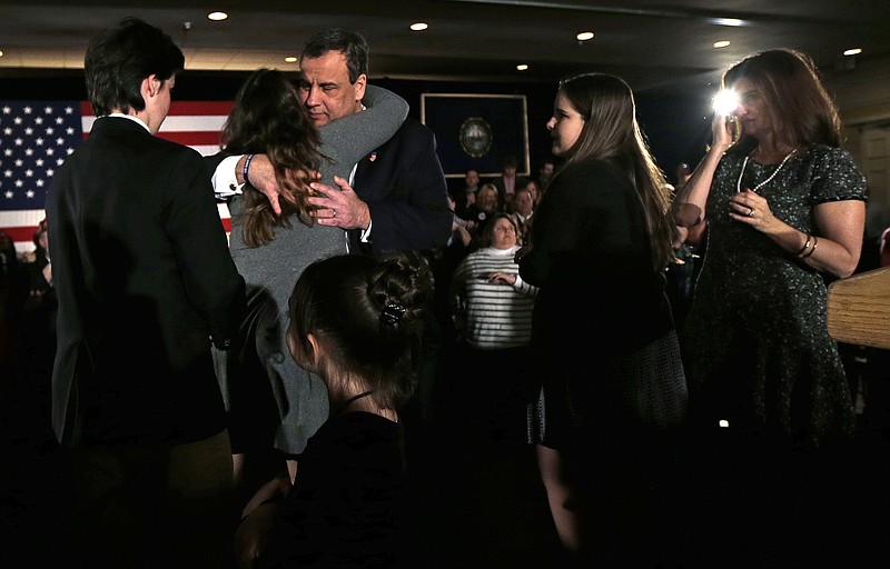 Republican presidential candidate, New Jersey Gov. Chris Christie embraces his children during a primary night rally in Nashua, N.H., Tuesday, Feb. 9, 2016.
