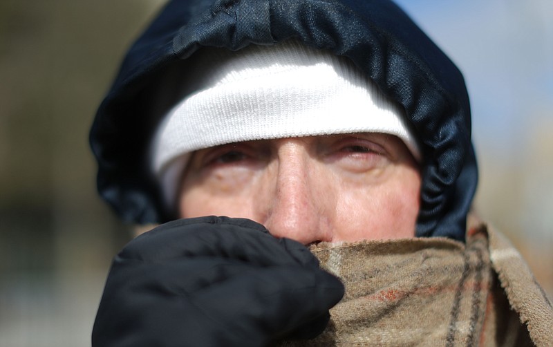 Jay Benedetti, from Atlanta, bundles up for the cold while attending a "prayer rally" led by Evangelist Rev. Franklin Graham at Liberty Plaza near the state Capitol, in Atlanta, Wednesday, Feb. 10, 2016. The rally was held as a powerful Georgia Senate committee is set to consider a bill allowing religious adoption agencies, schools, government workers and others to refuse services to same-sex couples without being penalized. The Senate Rules committee hearing is set for the same day Graham's father Billy Graham brings his "Decision America Tour 2016" to the Georgia state Capitol.