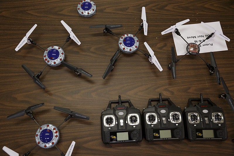 Radio controlled quads and controllers are set out on a table during the first session in an 8-week training course to teach people how to pilot drones at the Chattanooga Public Library on Saturday, Feb. 6, 2016, in Chattanooga, Tenn.