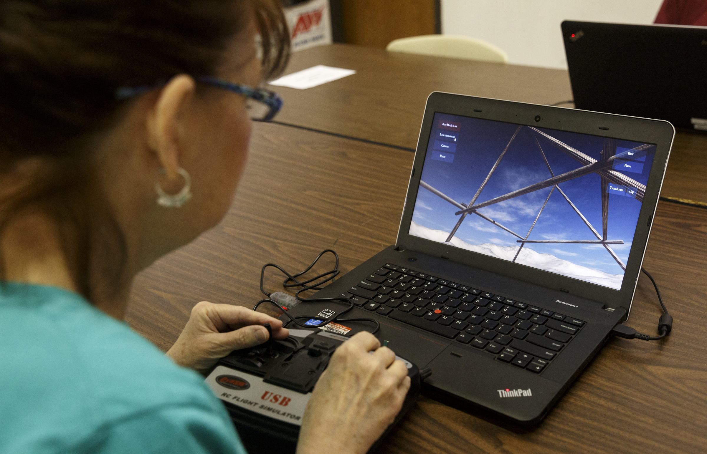Karla Rush uses a computer program to practice piloting drones during the first session in an 8-week training course to teach people how to pilot drones at the Chattanooga Public Library on Saturday, Feb. 6, 2016, in Chattanooga, Tenn.