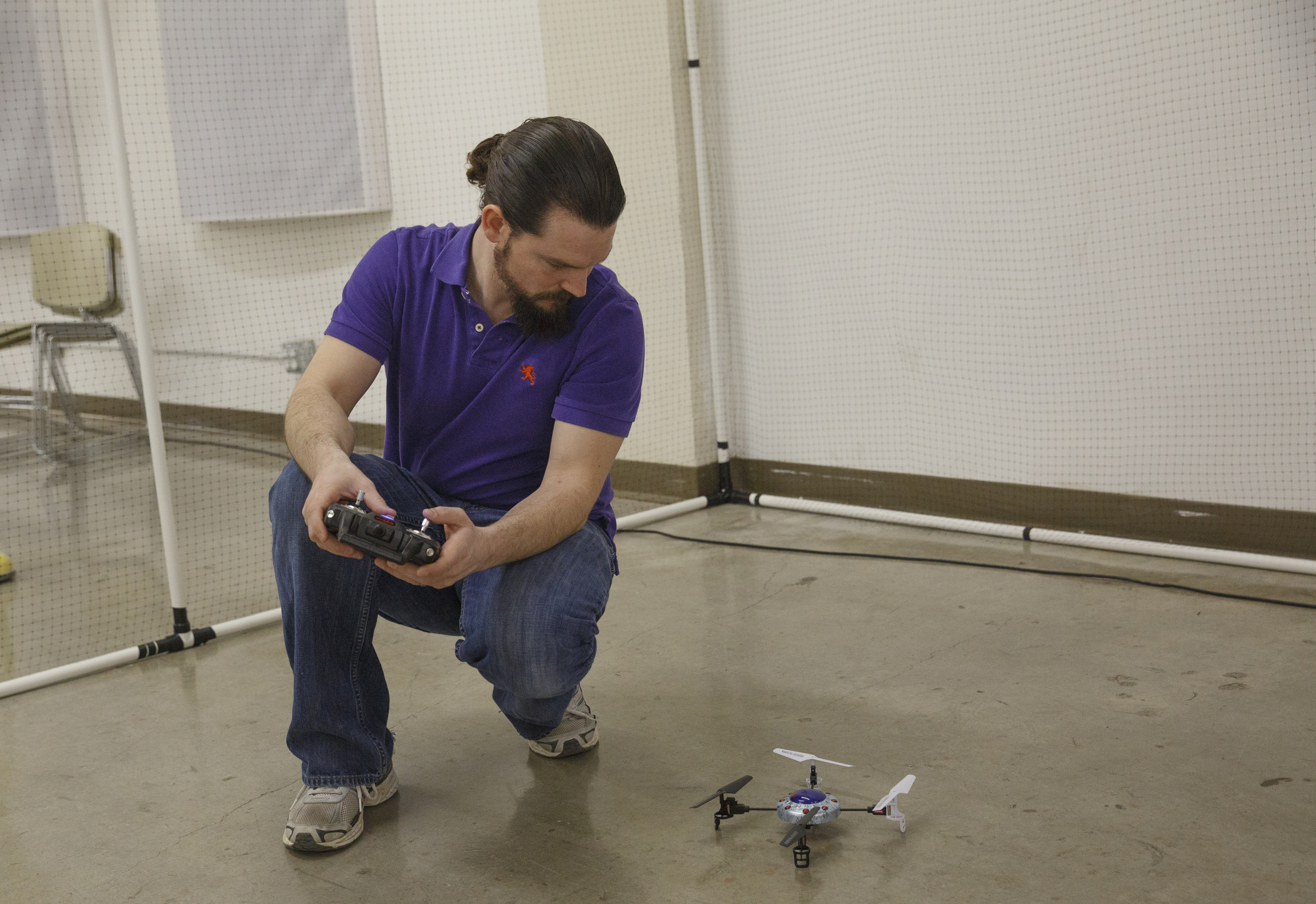 James Candan calibrates a drone during the first session in an 8-week training course to teach people how to pilot drones at the Chattanooga Public Library on Saturday, Feb. 6, 2016, in Chattanooga, Tenn.