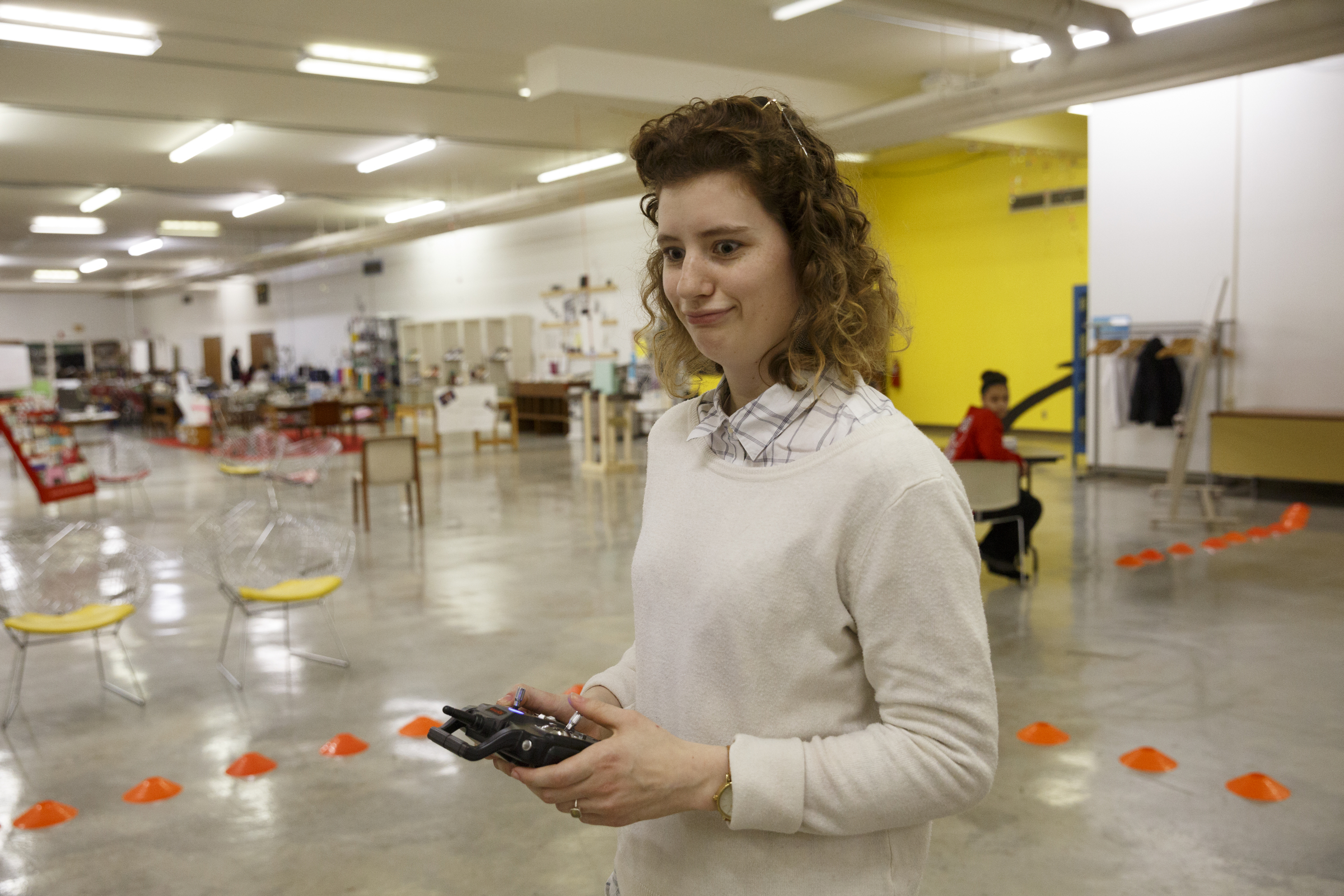 Emily Lindstrom reacts to crashing a drone during the first session in an 8-week training course to teach people how to pilot drones at the Chattanooga Public Library on Saturday, Feb. 6, 2016, in Chattanooga, Tenn.