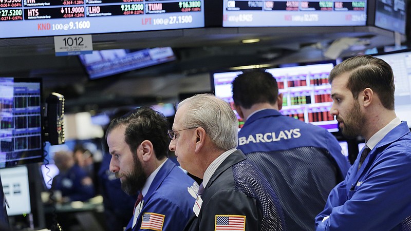Stock traders work at the New York Stock Exchange, Thursday, Feb. 11, 2016, in New York. (AP Photo/Mark Lennihan)