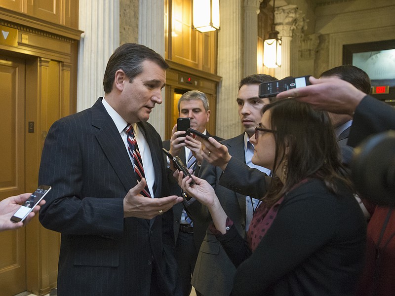 
              FILE - In this Feb. 10, 2016 file photo, Republican presidential candidate, Sen. Ted Cruz, R-Texas talks to reporters outside the Senate chamber on Capitol Hill in Washington. Cruz has campaigned against government spying on law-abiding citizens, but his campaign is testing the limits with personal data from his supporters. (AP Photo/J. Scott Applewhite)
            