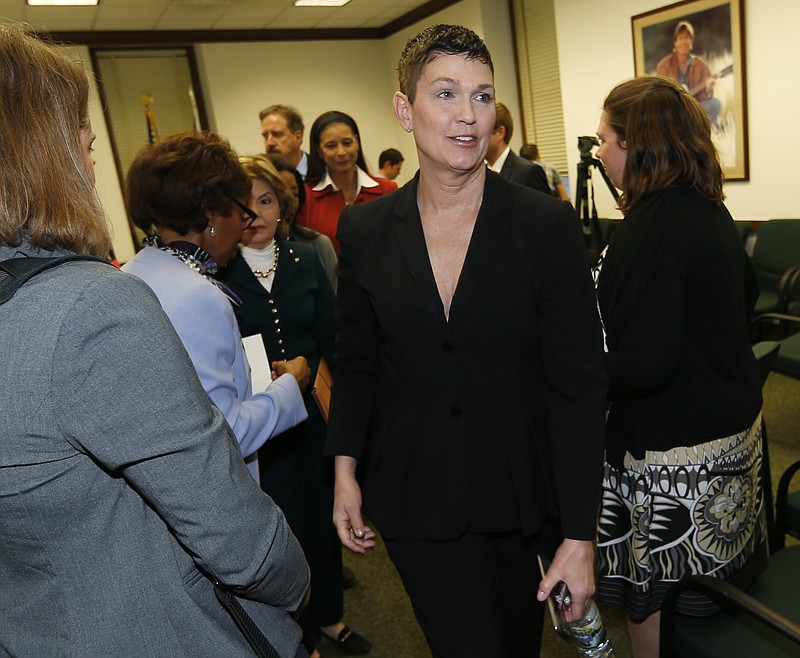 
              Beth Ferrier, one of two Denver women who claim to have been sexually assaulted by comic Bill Cosby, heads to a hearing room after a news conference Thursday, Feb. 11, 2016, in the State Capitol in Denver. Attorney Gloria Allred and the two Denver women were on hand to testify before a House committee on whether to permit rape victims to seek criminal charges against offenders beyond the state's 10-year statute of limitations. (AP Photo/David Zalubowski)
            