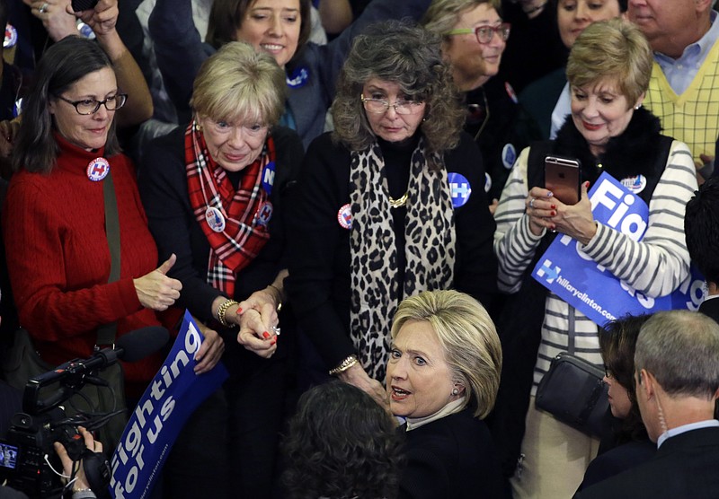 
              In this Feb. 9, 2016, photo, Democratic presidential candidate Hillary Clinton mingles with supporters at her New Hampshire presidential primary campaign rally in Hooksett, N.H. For young women, political revolution is currently trumping the idea of a Madame President. In New Hampshire, women under the age of 45 overwhelmingly backed Bernie Sanders over Clinton, exit polls showed. (AP Photo/Elise Amendola)
            