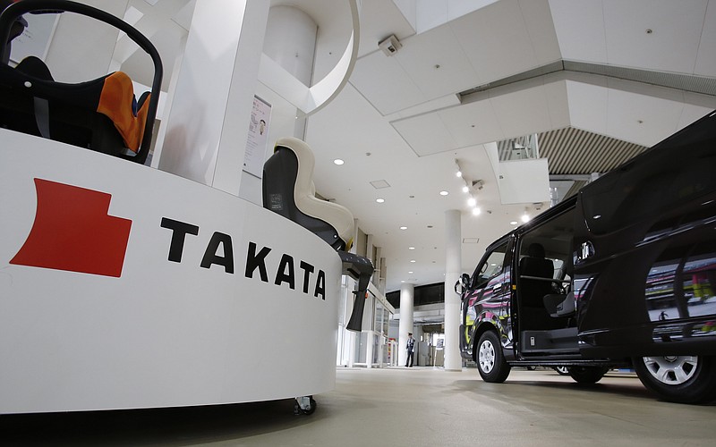 In this Nov. 6, 2014, file photo, child seats manufactured by Takata Corp. are displayed at a Toyota Motor Corp.'s showroom in Tokyo.