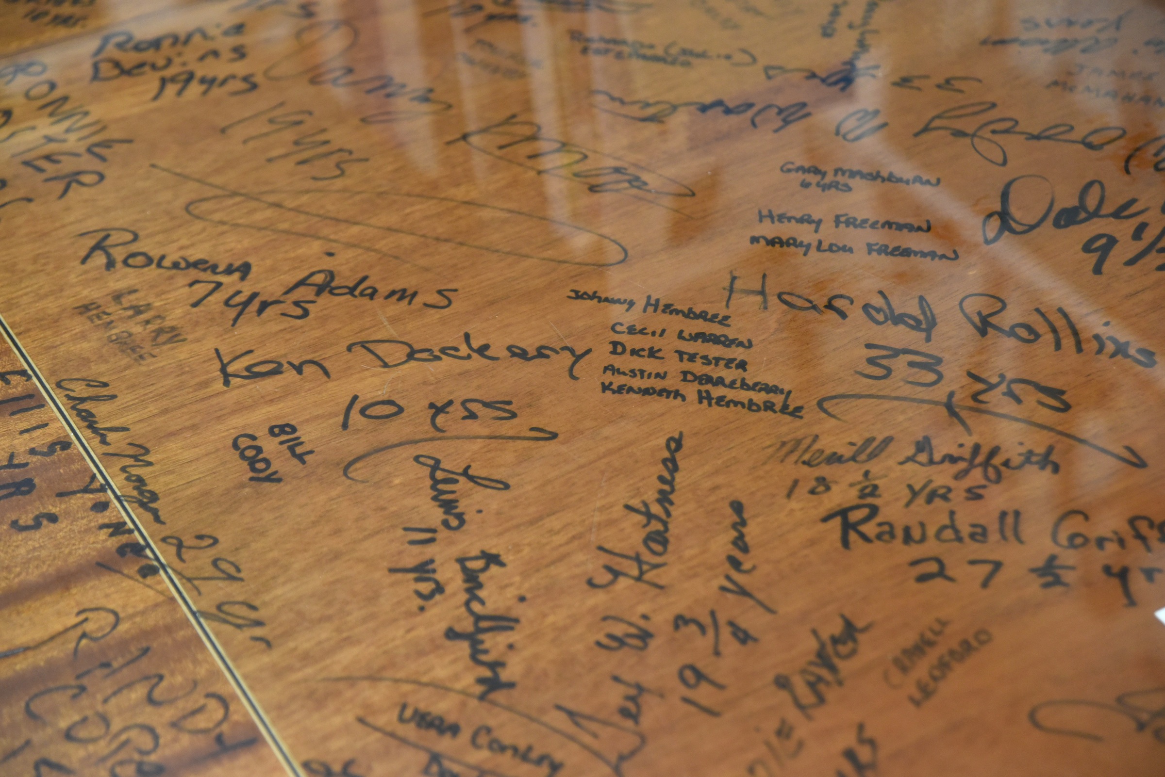 Employee signatures fill the top of the last product made at Baker Furniture Company in Andrews, N.C. The table is on display at the Cherokee County Historical Museum in Murphy, N.C.