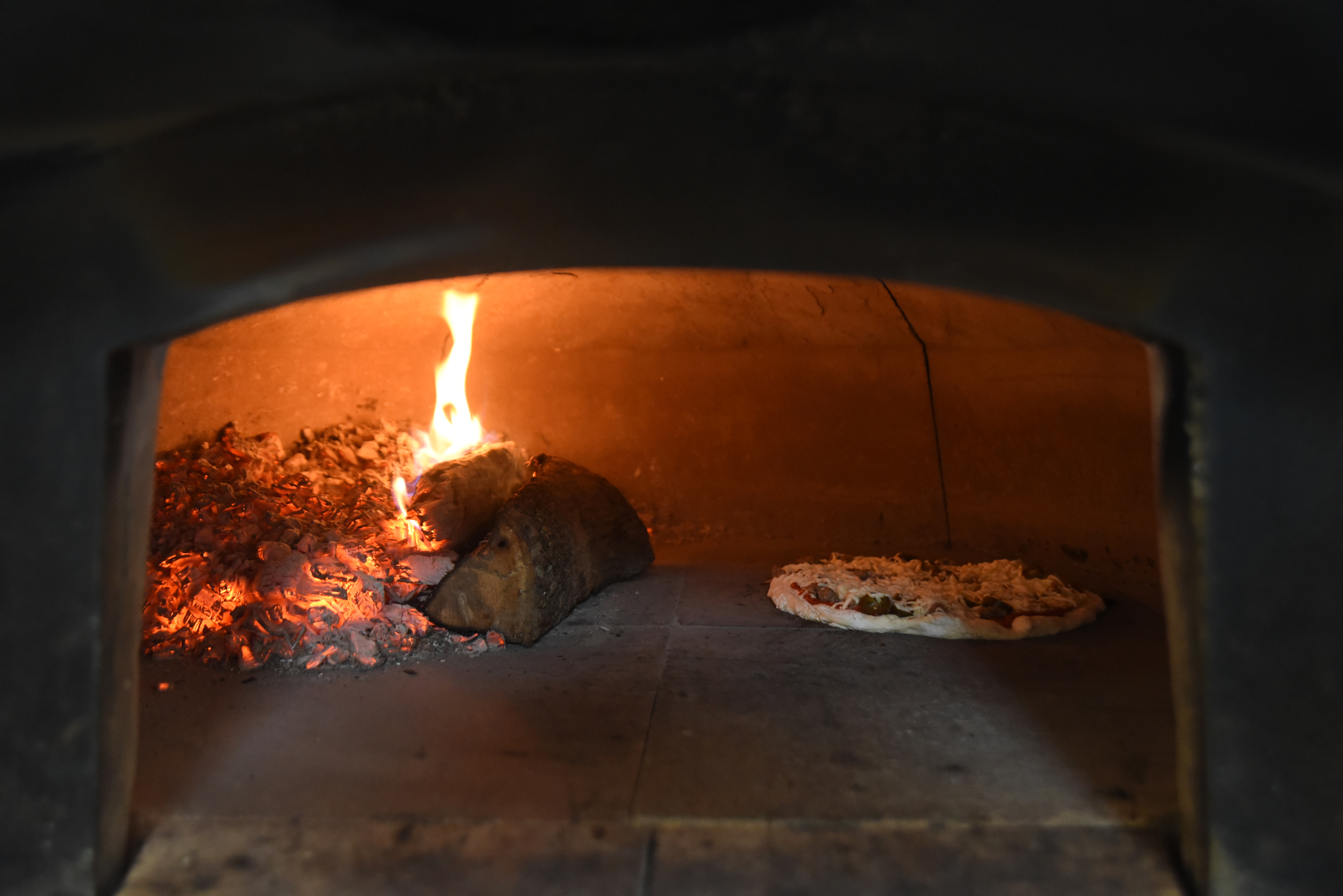 A pizza bakes in the wood fire oven at Valley River Brewery in Murphy, N.C., Tuesday, January 19, 2016.