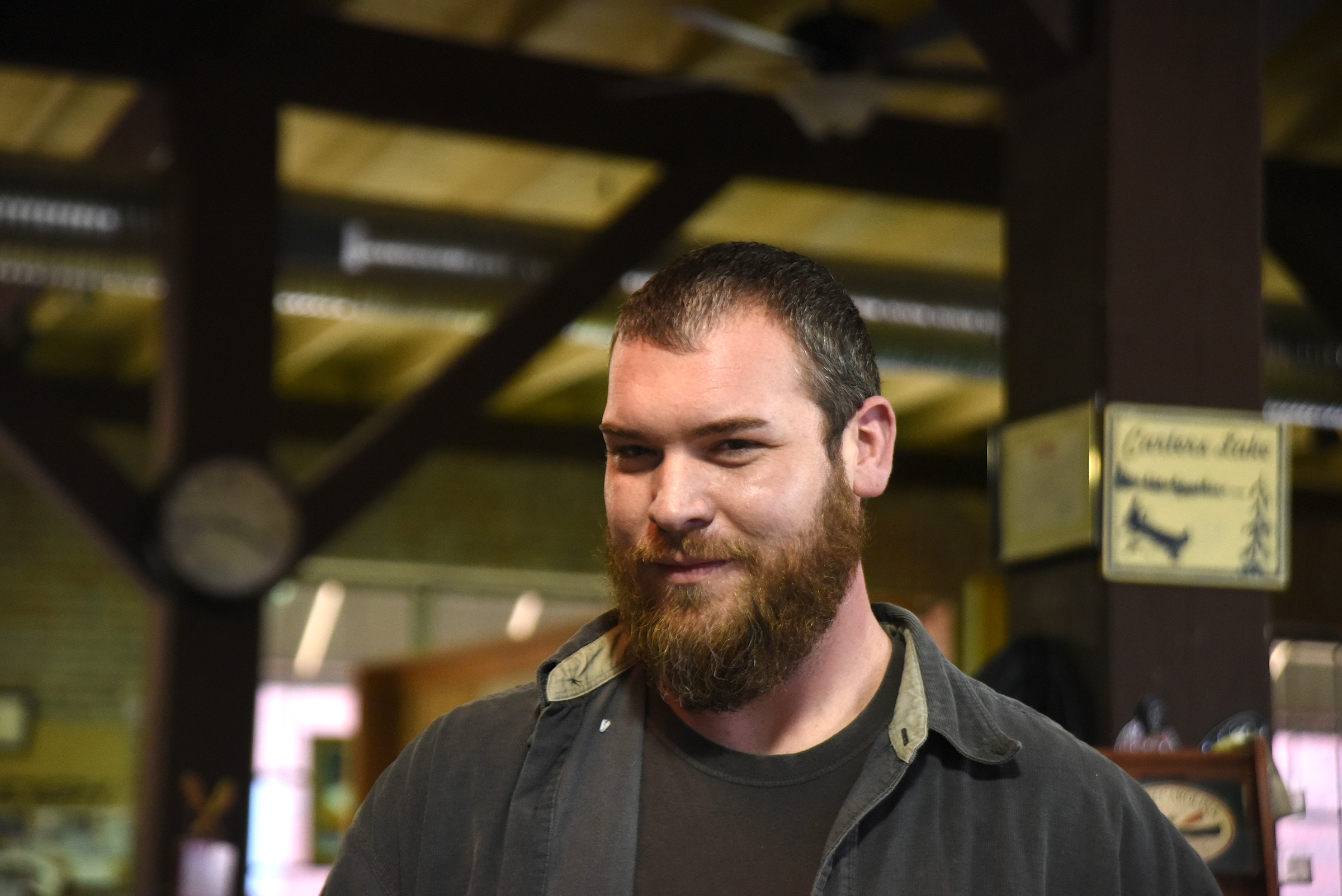 Justin Mickens talks in Appalachian Outfitters in Murphy, N.C., Tuesday, January 19, 2016.