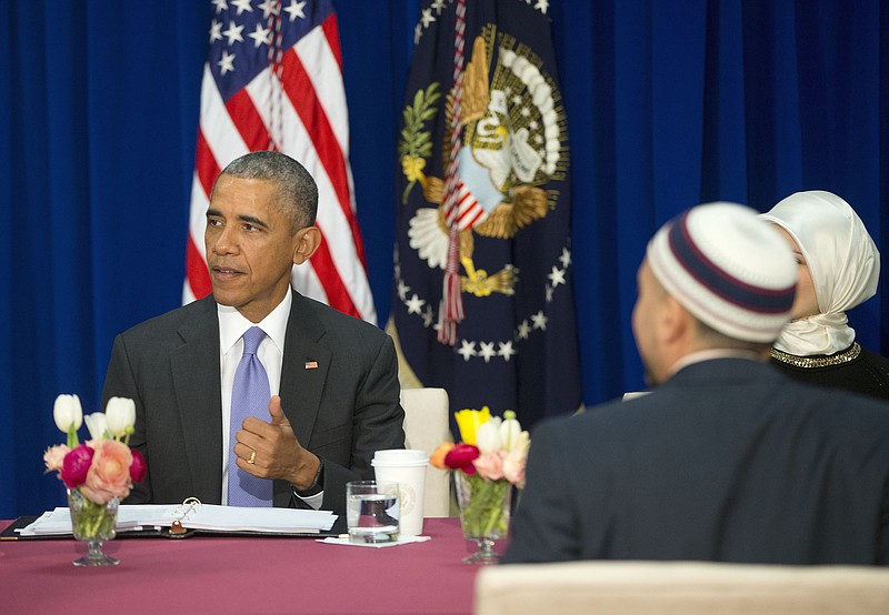 President Barack Obama, shown meeting recently with members of a Muslim-American community, hasn't matched his rhetoric with his governance.