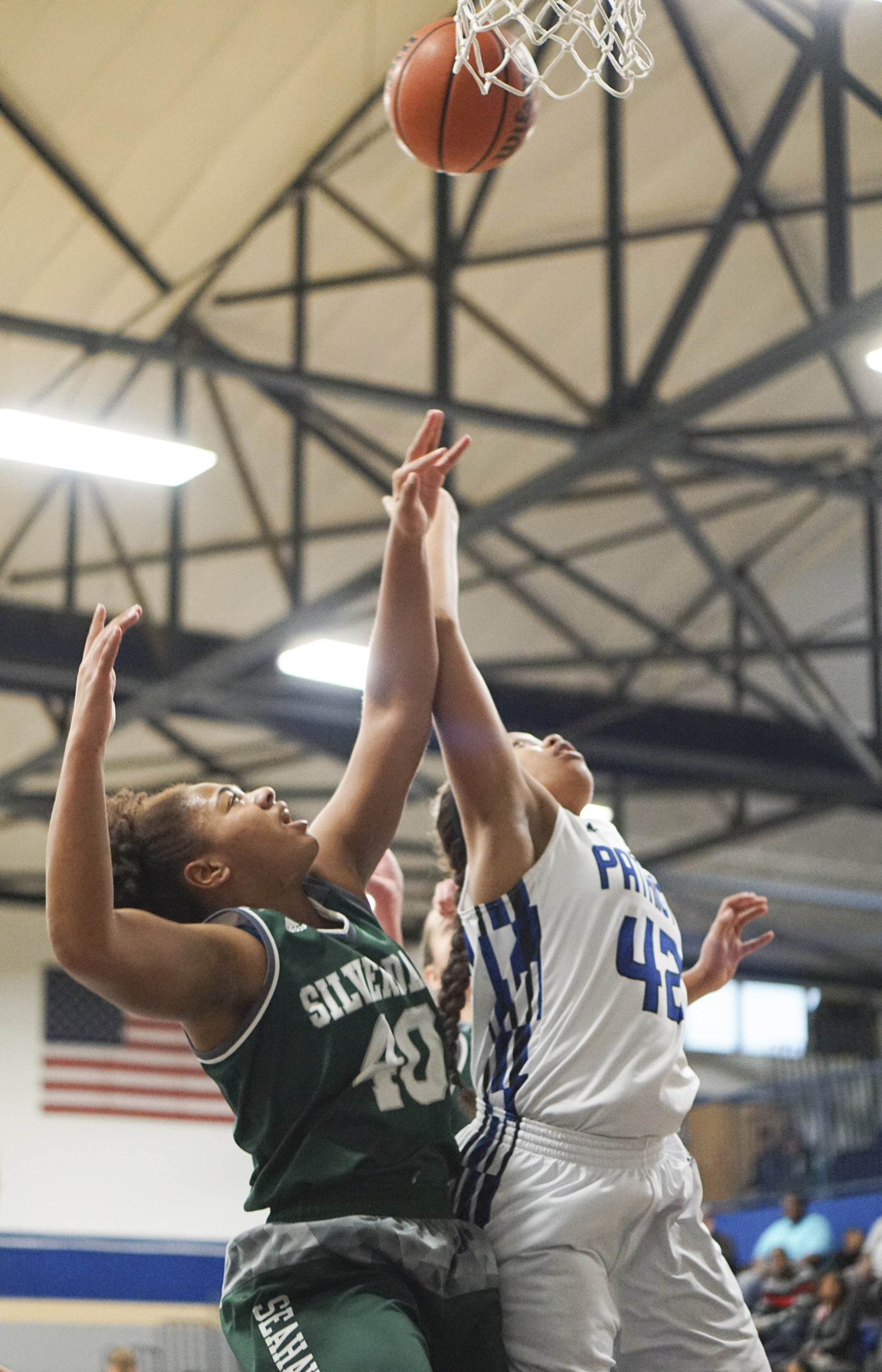 Staff Photo by Dan Henry / The Chattanooga Times Free Press- 2/12/16. Chattanooga School for the Arts and Sciences' Crystal Ealey (42) and Silverdale Baptist's Rachel Sanders (40) battle for a rebound during their matchup at the Lady Patriot's home court on Friday, February 12, 2016. Arts and Sciences won over Silverdale with a final score of 49-44.